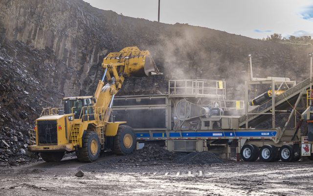 Wheel loader feeding a mobile crushing plant at a WCI rock crushing operation
